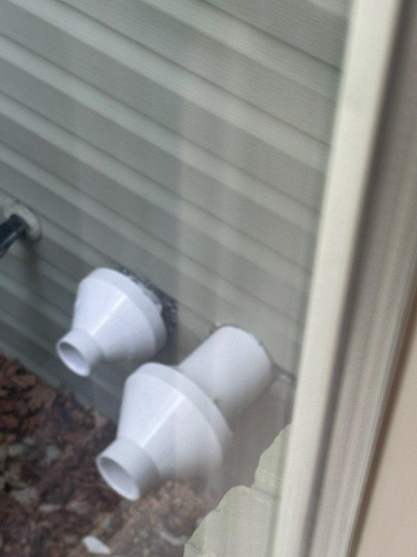 Responded to follow-up service call to address incomplete trim work from previous installation. Upon arrival, collected and removed loose PVC pipe fittings and connectors that had been left at the exterior foundation of the structure. Completed cleanup of installation debris including pipe reducers and adapters found near building perimeter and corrugated siding areas. Ensured all remaining materials were properly removed from the property to finalize the installation work.