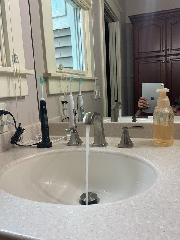 Responded to plumbing drain issue where newly installed faucet assembly included drain pipe with reduced diameter compared to existing P-trap connection. Installed appropriate transition fitting to connect the smaller drain tailpiece to the standard-size P-trap assembly, ensuring proper seal and drainage function. Verified all connections were secure with no leaks and system operating correctly.