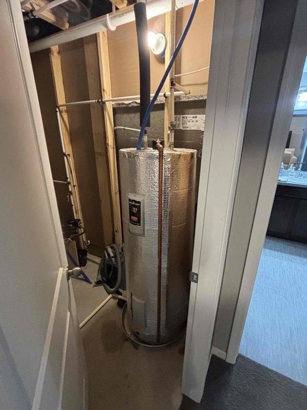 Responded to call regarding water heater not maintaining adequate hot water supply with suspected thermostat failure on 7-year-old unit. Upon arrival, performed diagnostic inspection of water heater system including visual examination of unit condition, electrical connections, and control components. Inspected electrical panel supplying power to water heater and verified proper circuit operation. Examined water heater insulation, piping connections, heating elements, and thermostat controls. Documented equipment condition and installation configuration with photographs for service records. Evaluated overall system performance and identified potential causes for inadequate hot water production.