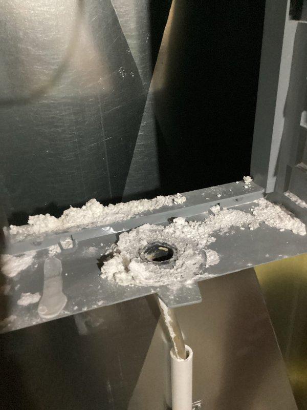 Completed annual heating maintenance on 9-year-old furnace and humidifier system. During inspection, discovered significant frost and ice crystal accumulation on air handler components and metal surfaces, indicating abnormal temperature regulation or airflow restriction. The frost buildup was concentrated around component seams, metal plates, and a circular port opening, with white crystalline deposits extending along equipment edges. Documented conditions with photographs showing the extent of ice formation on gray metal components and adjacent ductwork. The frost accumulation pattern suggests potential issues with condensate drainage, refrigerant flow, or humidity control that will require further diagnosis and correction to prevent system damage and ensure proper heating season operation.