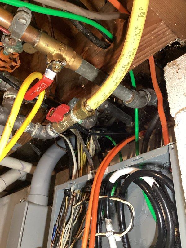 Responded to gas leak call on one-year-old EnergiAir furnace system that was not heating or cooling. Performed thorough inspection of gas piping connections, valves, and mechanical components in utility space. Conducted requested air test to verify system integrity and safety, documented all findings with photos of plumbing connections, gas lines, and mechanical assembly areas.