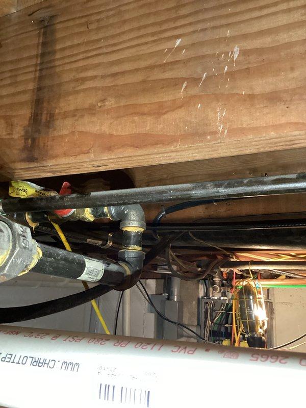 Responded to gas leak call on one-year-old EnergiAir furnace system that was not heating or cooling. Performed thorough inspection of gas piping connections, valves, and mechanical components in utility space. Conducted requested air test to verify system integrity and safety, documented all findings with photos of plumbing connections, gas lines, and mechanical assembly areas.