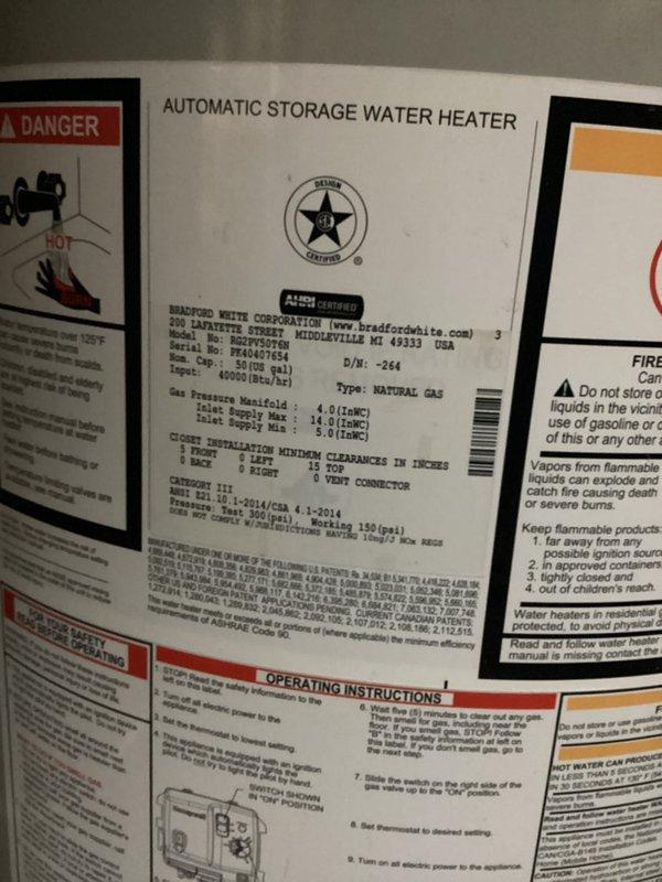 Responded to water leak service call and conducted thorough inspection of residential water heating system. Upon arrival, examined 40-gallon Bradford White natural gas water heater manufactured in 2014 and associated plumbing infrastructure. Inspected all visible connections, supply lines, and discharge piping for signs of active leakage or moisture accumulation. Evaluated sump pump system and drainage assembly located in basement utility area, including PVC discharge piping with multiple directional changes and copper supply lines running along structural framing. Verified proper operation of pump unit and checked all pipe joints and fittings for integrity. Documented equipment condition and installation configuration through photographic records showing water heater specifications, safety labeling, and mechanical systems layout including flexible ductwork and metallic components in utility space.