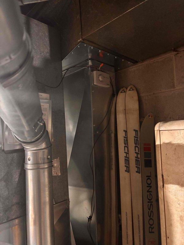 Completed installation of AprilAire whole-home humidifier unit mounted to main supply ductwork. Connected electrical wiring and water supply lines to humidifier, integrated unit with existing HVAC system to provide automated humidity control throughout the residence. System tested and operational upon departure.