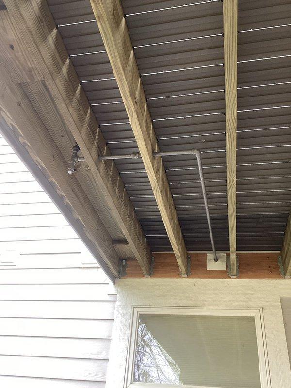 Returned to property to complete re-installation of gas line on covered porch for outdoor grill connection. Gas line was properly routed along ceiling support beams and secured with appropriate mounting hardware. Installation completed as scheduled with all work performed in accordance with local gas fitting codes and safety standards.