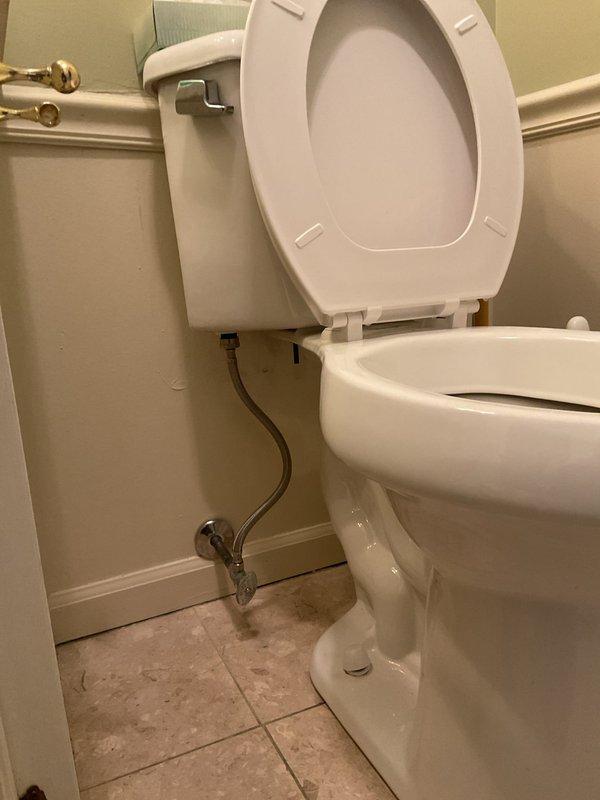Responded to customer request for bidet toilet installation quote. Conducted on-site assessment of existing bathroom plumbing configuration, photographed current two-piece toilet with wall-mounted tank, chrome angle stop valve, and braided stainless steel supply line. Evaluated bathroom layout, fixture placement, and existing water supply connections to determine feasibility and provide accurate estimate for bidet toilet replacement.