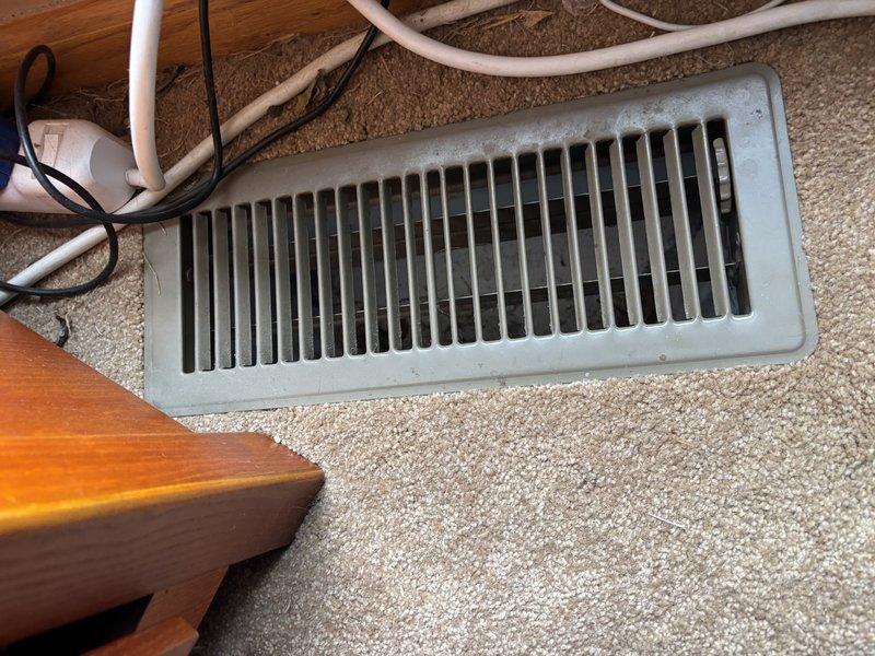 Responded to service call for unidentified noise coming from 6-year-old Lennox furnace. Upon arrival, reviewed customer-provided video of the noise to assist with diagnosis. Conducted thorough inspection of furnace system and air distribution components. Discovered significant debris accumulation consisting of dried plant matter, twigs, and organic material lodged in exterior vent opening. Interior floor register also showed dust buildup. Removed all debris from exterior duct opening and cleaned affected areas. Inspected furnace blower assembly, motor bearings, and belt for mechanical issues that could contribute to noise. Verified proper airflow through system after clearing obstructions. Cycled furnace through multiple heating cycles to confirm noise was eliminated. System operating normally with no abnormal sounds detected upon completion. Advised customer to monitor for any recurring issues.