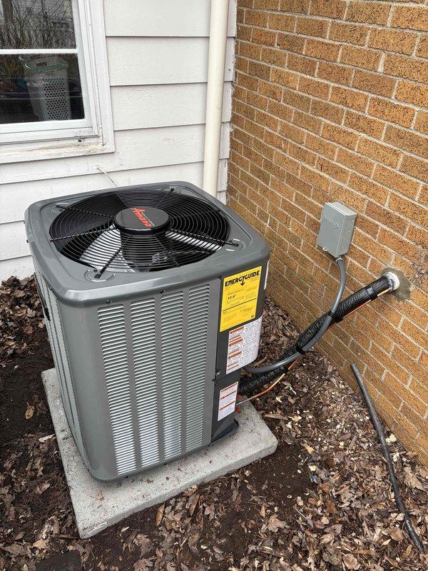 Completed full ACREP-AC installation including Rheem furnace and air handler in basement mechanical room with associated condensate drain lines and PVC venting. Installed outdoor condensing unit on concrete pad with refrigerant line set, electrical disconnect box, and all required connections. System tested and verified operational with all manufacturer labels and safety documentation properly affixed.