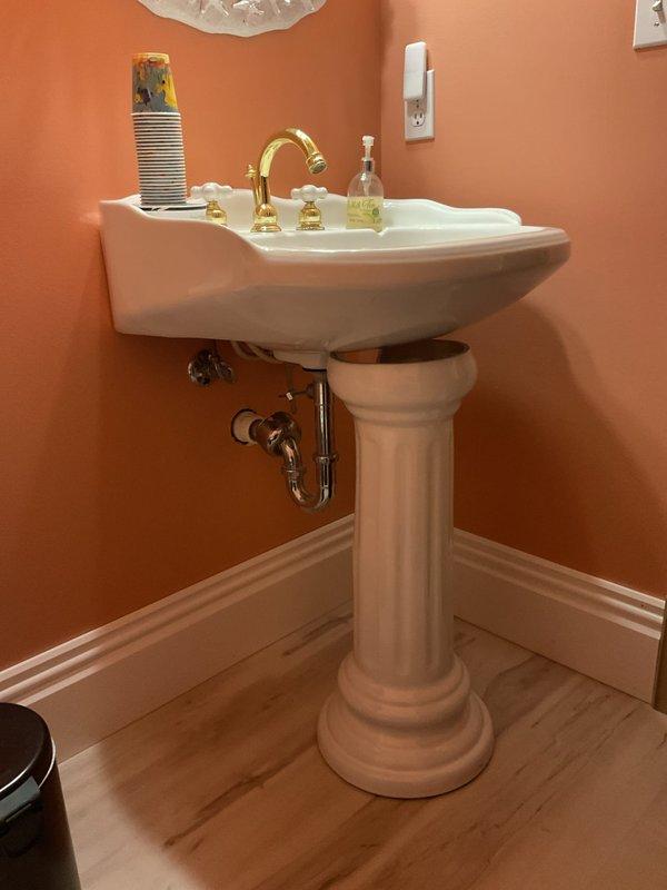 Provided project estimate for replacement of failed main home shutoff valve in a 30-year-old residence. Additionally assessed feasibility and provided estimate for relocating existing pedestal sink to a higher mounting position in powder room with peach-colored walls and laminate flooring.