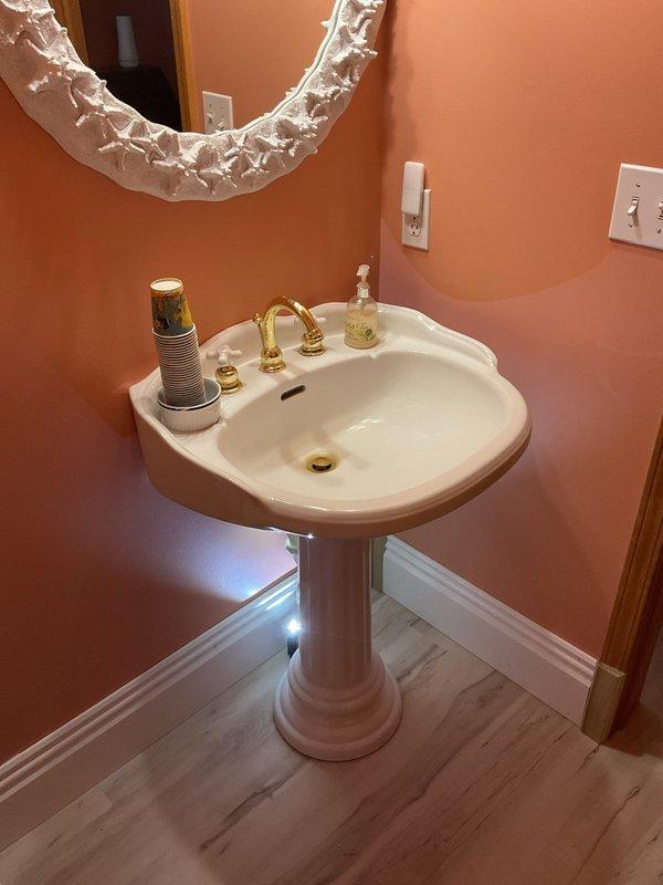 Provided project estimate for replacement of failed main home shutoff valve in a 30-year-old residence. Additionally assessed feasibility and provided estimate for relocating existing pedestal sink to a higher mounting position in powder room with peach-colored walls and laminate flooring.