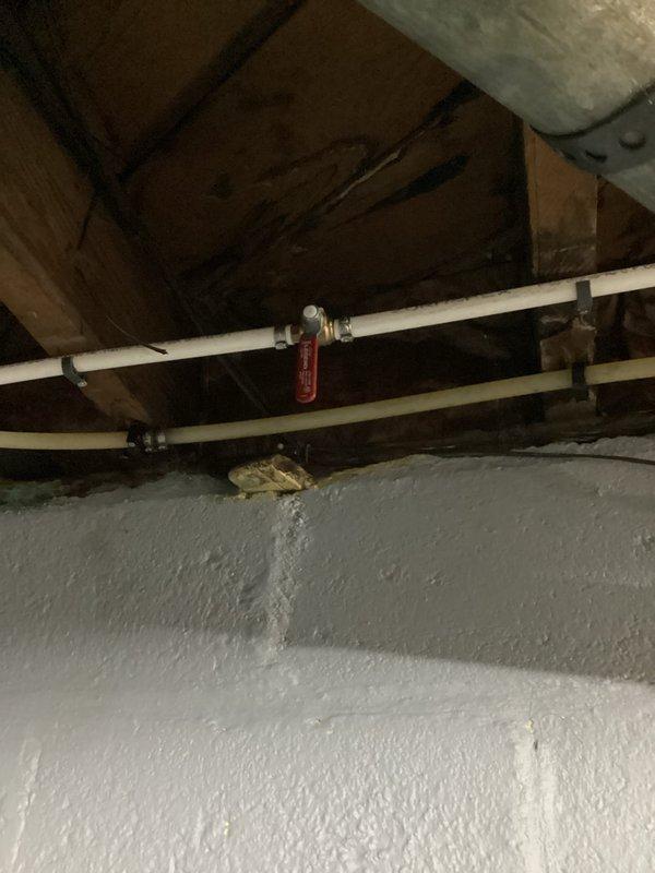 Installed two shut-off valves for exterior hose bibs to provide seasonal water control and freeze protection. Valves were located in the crawl space and properly secured to copper supply lines serving the outdoor faucets, allowing the homeowner to isolate and drain the exterior plumbing during winter months to prevent freeze damage.
