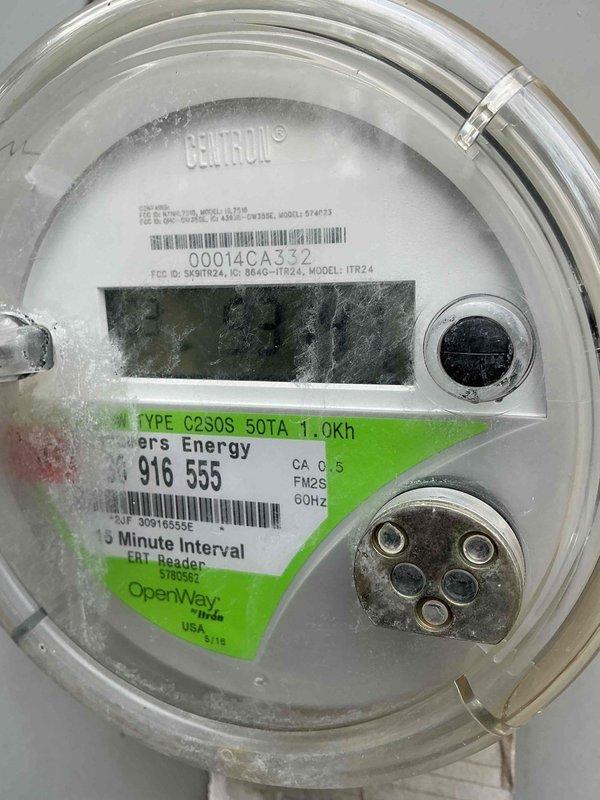 Responded to electrical service call for multiple fixture issues and surge protection evaluation. Inspected vanity light fixtures, ceiling fan operation, and malfunctioning light switch as requested. Documented existing electrical meter installation and exterior service panel configuration. Meter displayed proper utility connection with digital interval recording capabilities and standard residential service specifications. External electrical components showed typical weathering consistent with outdoor exposure. Assessed overall electrical system condition and provided recommendations for fixture replacements and whole-house surge protection options to enhance electrical safety and system reliability.