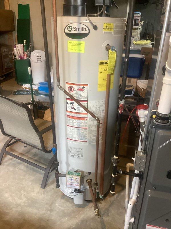 Responded to call regarding inconsistent hot water distribution throughout residence, with washing machine receiving no hot water and varying temperatures at different fixtures. Upon arrival, inspected A.O. Smith water heater installation in basement utility area and evaluated connected copper plumbing system. Examined water heater operation, temperature settings, and distribution lines to identify cause of uneven hot water delivery. Assessed plumbing connections to washer location and traced supply lines to affected fixtures. Documented existing water heater condition and surrounding plumbing infrastructure including water treatment system and PVC connections. Investigated potential issues with mixing valves, supply line restrictions, or cross-connection problems affecting hot water flow to specific areas of home. Checked for evidence of leaks or moisture accumulation around water heater base and floor area. Provided diagnostic assessment of hot water distribution system and identifie