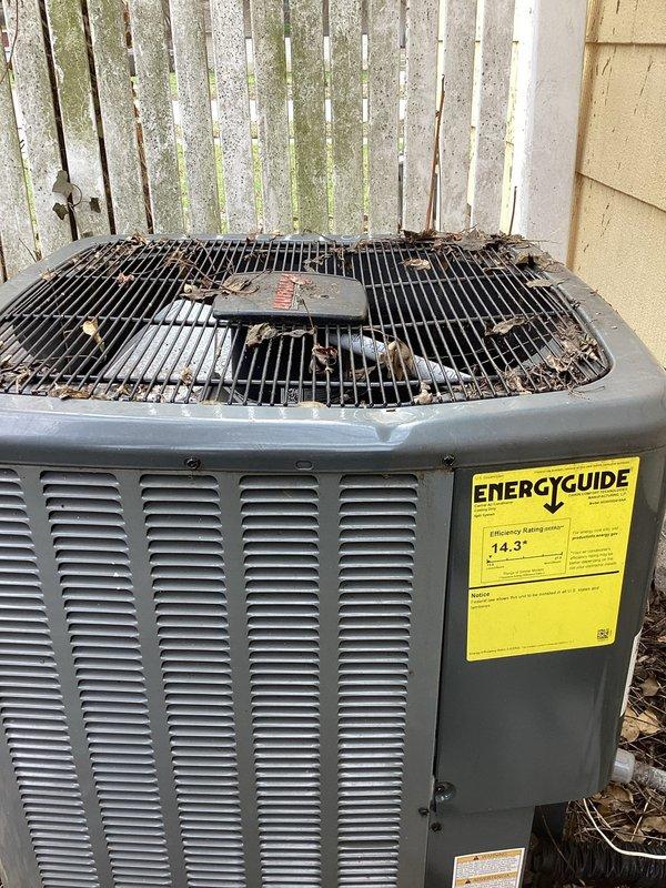 Completed annual cooling system maintenance on residential air conditioning unit. Removed debris including leaves and organic material from condenser top grille and surrounding area. Performed standard AC tune-up procedures including system inspection, cleaning of condenser coils, and verification of proper operation. Unit currently functioning within normal parameters with 14.3 SEER rating, warranty coverage extending through April 2033.