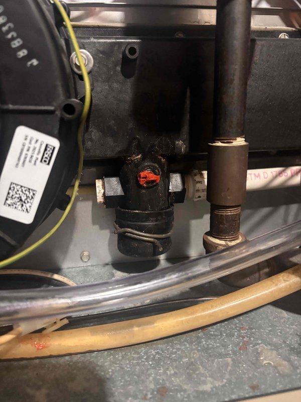 Completed annual heating maintenance on 28-year-old Lennox furnace system without humidifier. Performed comprehensive tune-up including inspection of blower motor assembly, electrical connections, and internal components. Verified proper operation of FASCO blower motor, checked all wire connections and terminals for secure contact, and inspected burner assembly with focus on ignition components. Documented equipment condition with photos showing blower motor housing, electrical wiring, and internal mechanical components. All systems tested and confirmed operational for heating season.