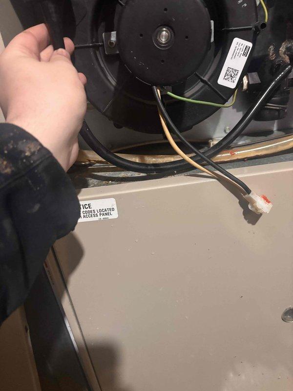 Completed annual heating maintenance on 28-year-old Lennox furnace system without humidifier. Performed comprehensive tune-up including inspection of blower motor assembly, electrical connections, and internal components. Verified proper operation of FASCO blower motor, checked all wire connections and terminals for secure contact, and inspected burner assembly with focus on ignition components. Documented equipment condition with photos showing blower motor housing, electrical wiring, and internal mechanical components. All systems tested and confirmed operational for heating season.