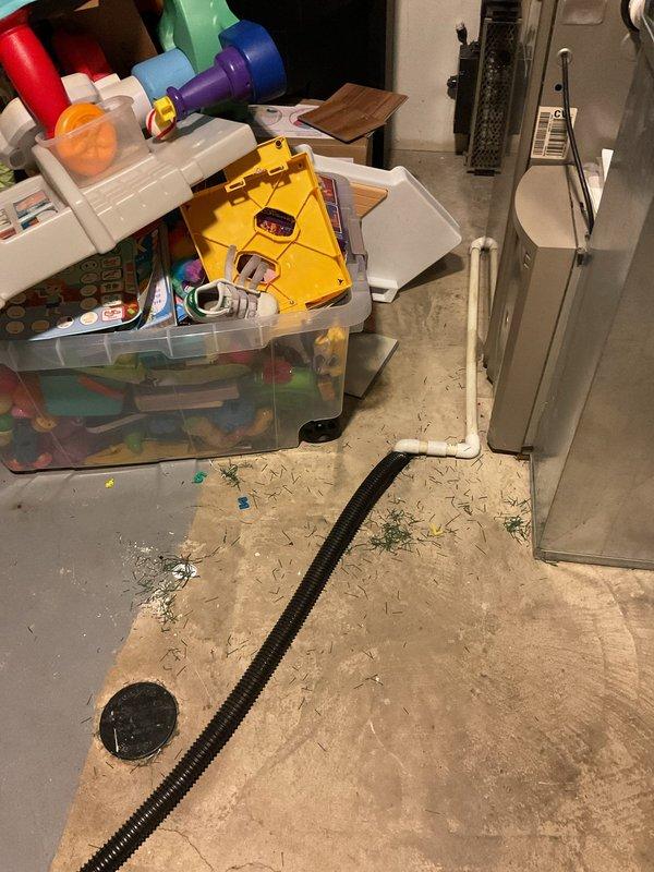 Conducted on-site evaluation of existing sump pump system in basement utility area for replacement estimate. Assessed current pump configuration, discharge piping, electrical connections, and drainage routing to determine scope of replacement work and equipment specifications needed for proper water management system installation.