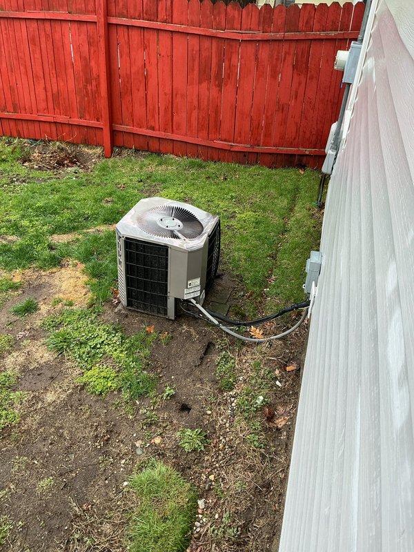 Completed estimate for replacement of 22-year-old residential air conditioning system showing significant age-related wear. Documented existing outdoor condenser unit and attic-mounted ductwork system with visible dust accumulation and surface deterioration, provided replacement options for complete HVAC system upgrade.