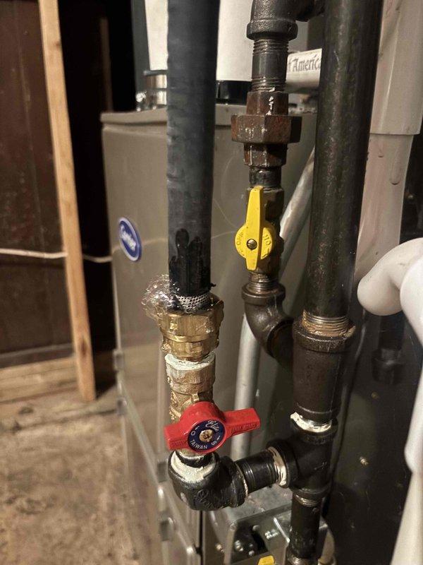 Completed annual cooling maintenance on 8-year-old Lennox system originally installed in 2017. Performed comprehensive tune-up inspection of air handler unit, verified proper operation of all components, and documented equipment conditions with photos of mechanical room showing HVAC system, associated plumbing connections, and water heater installation. System operating within normal parameters with no immediate concerns identified.