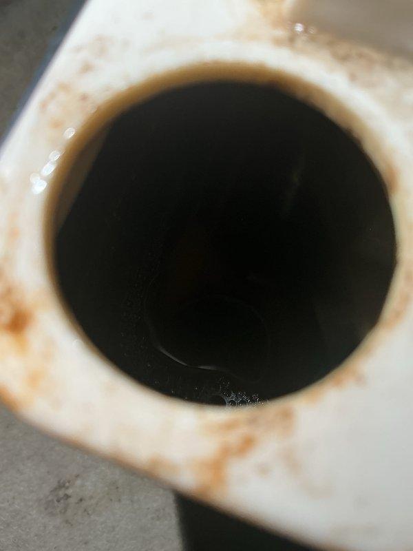 Completed annual cooling maintenance on 2014 EnergiAir system with warranty coverage through July 2026. Performed comprehensive electrical diagnostics using multimeter to verify proper voltage and amperage readings at control board, capacitor, and terminal connections. Inspected condensate drain system and documented moderate staining around drain pipe opening indicating previous moisture accumulation. All electrical components tested within manufacturer specifications, wiring connections secure, and system operating normally at completion of tune-up service.