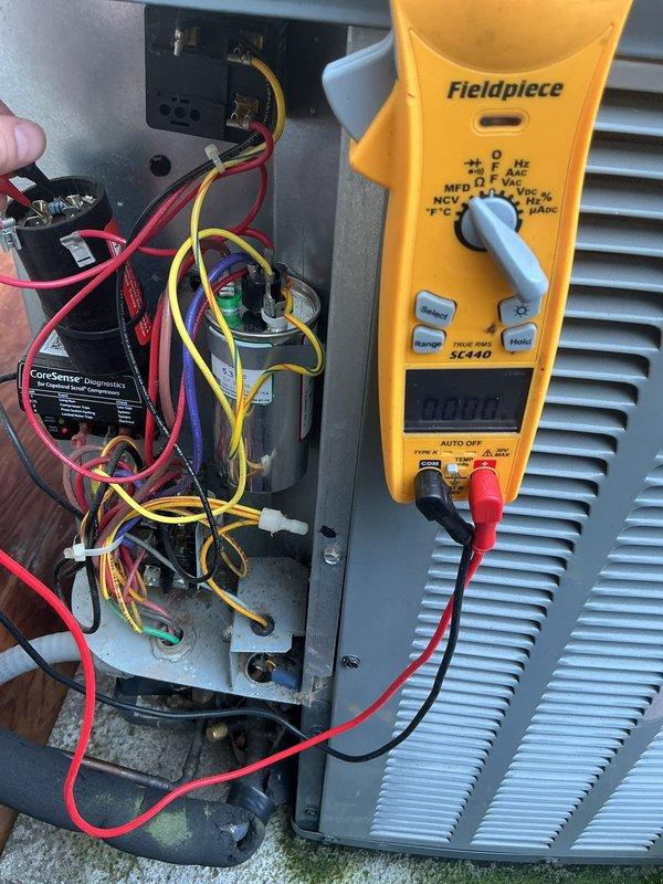 Completed annual cooling maintenance on 2014 EnergiAir system with warranty coverage through July 2026. Performed comprehensive electrical diagnostics using multimeter to verify proper voltage and amperage readings at control board, capacitor, and terminal connections. Inspected condensate drain system and documented moderate staining around drain pipe opening indicating previous moisture accumulation. All electrical components tested within manufacturer specifications, wiring connections secure, and system operating normally at completion of tune-up service.