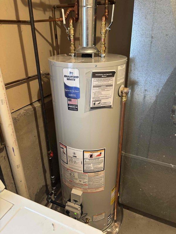 Successfully installed a Bradford White 40-gallon natural gas water heater, model RG240U6N, in the basement utility area. Connected copper supply lines and gas piping to the unit with proper brass fittings and valves, ensuring all connections were secure and leak-free. Verified proper venting configuration for Category I natural draft operation and confirmed all manufacturer specifications including 40,000 BTU/hr input rating and 150 psi working pressure were met per installation requirements.