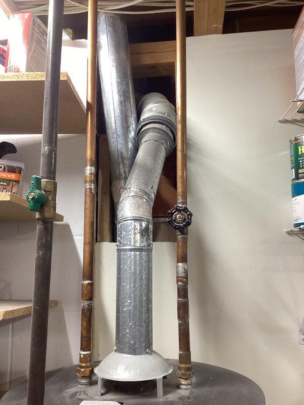 Conducted comprehensive on-site evaluation of existing water heater and plumbing infrastructure to provide estimate for new water conditioning system and filtration equipment installation. Assessed basement utility area including current water heater configuration, copper supply line routing, venting system capacity, and available space for additional water treatment equipment. Documented existing plumbing connections, shut-off valve locations, and structural considerations for proposed system integration.
