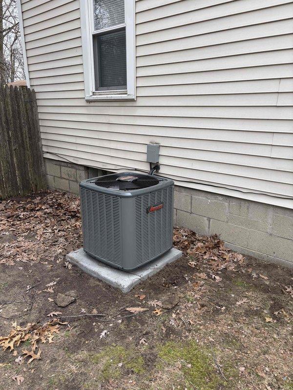 Completed full HVAC system installation including new furnace, air conditioning condenser unit, and Bradford White water heater in residential utility room. Installed Amana brand outdoor condenser unit on concrete pad with proper electrical disconnect, routed refrigerant lines to indoor air handler, and configured all PVC condensate drainage and venting systems. Connected all gas lines, copper water piping, metallic ductwork transitions, and verified proper operation of all newly installed equipment with system startup and testing procedures.