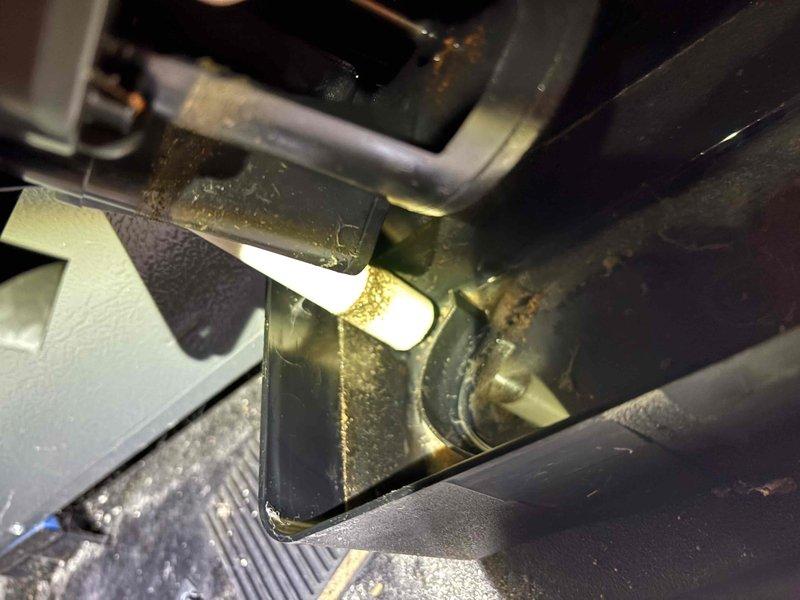 Completed annual cooling maintenance on 14-year-old Trane system. Inspected and documented condition of air filter showing significant dust and debris accumulation in pleated media; checked indoor air handler components revealing contamination on evaporator coil and surrounding surfaces with visible moisture staining on metal housing. Photographed equipment condition for service records.