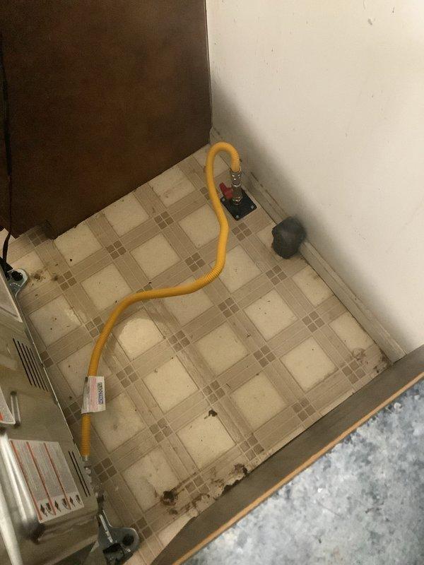 Installed new gas line from existing supply to kitchen stove location. Routed flexible gas connector from wall-mounted shutoff valve to appliance connection point, ensuring proper clearances and secure fittings throughout installation. All connections tested and verified leak-free per code requirements.