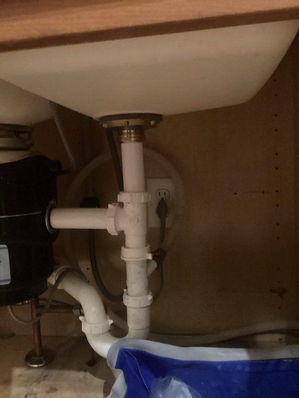 Responded to a drain service call for a bathroom sink. Upon inspection, found the sink draining properly with all plumbing components functioning correctly. The P-trap assembly under the sink was clean and properly configured with no visible leaks or blockages. Verified drain operation, confirmed the pop-up drain assembly and strainer basket were clear of debris, and ensured the overflow drain was unobstructed. All connections were secure and the plumbing system was operating as designed.