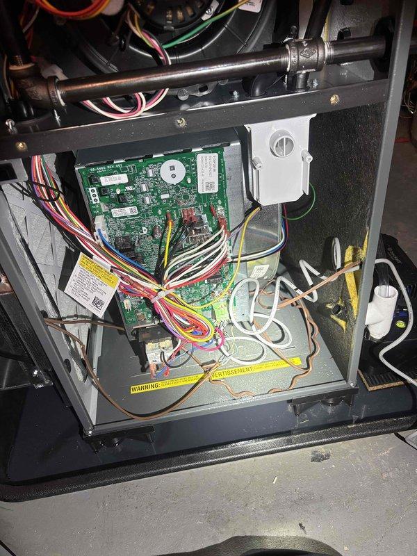 Responded to no-heat call on newly installed furnace. Upon arrival, inspected control board and wiring connections throughout unit. Verified all wire terminations at circuit board were secure and properly seated. Checked blower motor connections and power supply. Traced all low-voltage and line-voltage wiring for proper installation. Photographed control board assembly and internal components for warranty documentation. System operational at time of departure with heat functioning as designed.