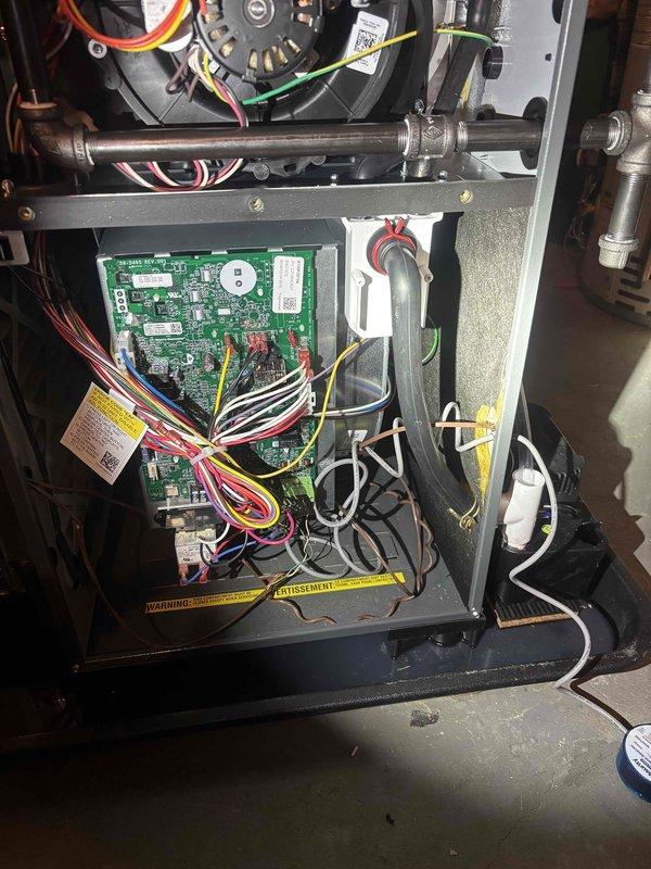 Responded to no-heat call on newly installed furnace. Upon arrival, inspected control board and wiring connections throughout unit. Verified all wire terminations at circuit board were secure and properly seated. Checked blower motor connections and power supply. Traced all low-voltage and line-voltage wiring for proper installation. Photographed control board assembly and internal components for warranty documentation. System operational at time of departure with heat functioning as designed.