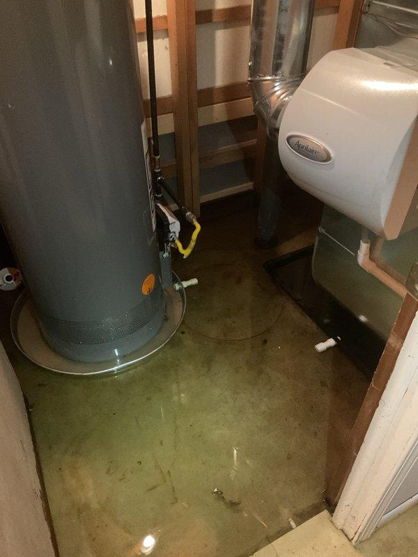 # No Heat Service Call

Responded to no heat call with alarm sounding at furnace. Upon arrival, found significant water pooling on basement floor around HVAC equipment and water heater. Investigation revealed condensate drain system failure, causing water backup that triggered the furnace safety float switch and alarm.

Located malfunctioning condensate pump assembly with electronic control unit at base of PVC drain line. Pump had failed to evacuate condensate water, resulting in overflow condition throughout mechanical space. Water accumulation activated furnace safety lockout to prevent equipment damage.

Cleared water from affected area and removed failed condensate pump. Installed new condensate pump assembly with safety switch. Reconnected PVC drain lines and verified proper discharge operation. Tested pump cycling under load to ensure adequate flow rate and proper float switch function.

Reset furnace control board and cleared alarm code. Verified all safety interlocks functionin