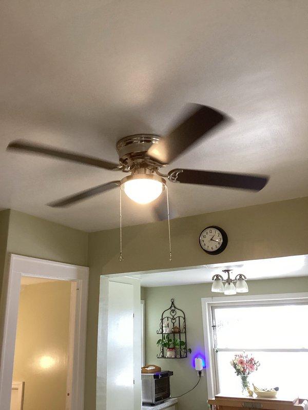 Responded to service call for non-functioning bathroom exhaust fan and kitchen ceiling fan light fixture in century-old residential property. Inspected bathroom fan unit mounted in wall cavity near ceiling, noting accumulated dust and debris around opening and verified electrical connections and switch operation. Evaluated kitchen ceiling fan with integrated light fixture, testing pull chain controls, light operation, and fan motor function. Addressed electrical issues that had persisted for approximately six months, performing necessary repairs to restore proper operation of both fixtures while ensuring all work met current electrical code requirements for older home wiring systems.