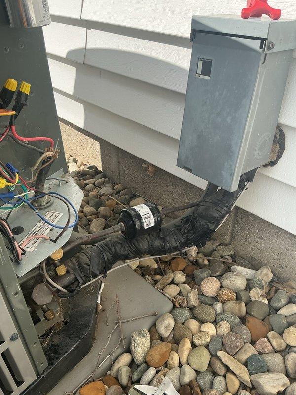 Completed annual cooling maintenance on 2-year-old American Standard air conditioning system. Performed comprehensive inspection of outdoor unit, verified electrical connections and disconnect switch operation, checked refrigerant lines and conduit routing, and inspected interior components including wiring harness, control board connections, and mechanical assemblies. All system components found to be operating within normal parameters with no immediate service concerns identified.