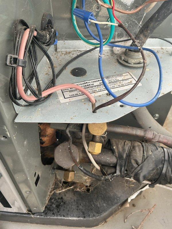 Completed annual cooling maintenance on 2-year-old American Standard air conditioning system. Performed comprehensive inspection of outdoor unit, verified electrical connections and disconnect switch operation, checked refrigerant lines and conduit routing, and inspected interior components including wiring harness, control board connections, and mechanical assemblies. All system components found to be operating within normal parameters with no immediate service concerns identified.