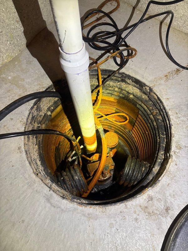 Responded to sump pump concern running frequently every 5-10 minutes due to recent heavy rainfall. Inspected 8-year-old sump pump system in basement pit, examining pump mechanism, float assembly, discharge piping, and electrical connections. Verified pump operation, checked for proper cycling, and assessed overall system functionality to ensure adequate water removal capacity during high-volume conditions.