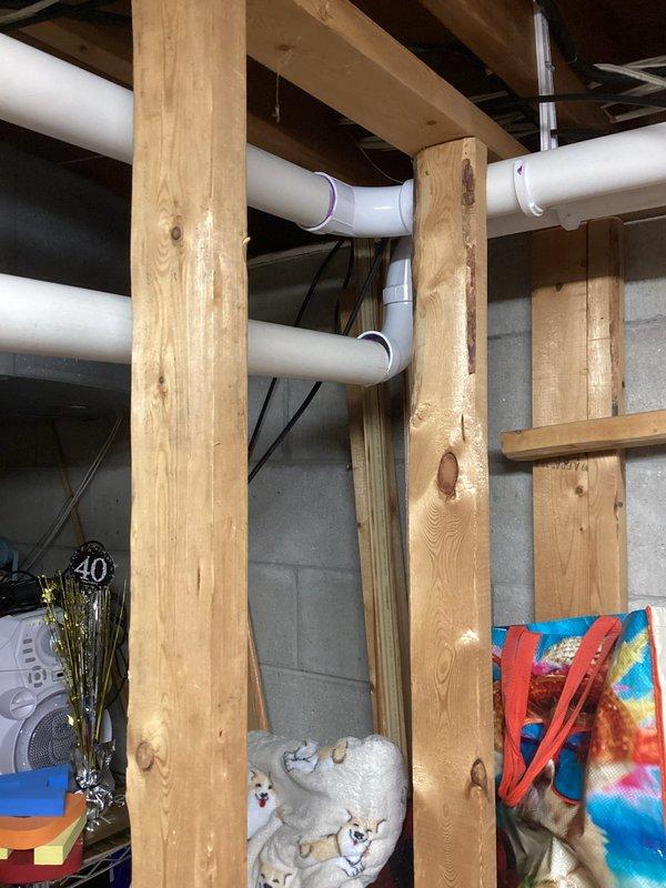 Completed annual cooling maintenance and system inspection on residential HVAC unit. Inspected condensate pump assembly and drainage system in mechanical room, verified proper operation of pump mechanism and PVC drain lines, confirmed adequate water discharge with no blockages present. Documented existing moisture staining on floor surface consistent with normal condensate drainage activity. All components functioning within normal parameters, system ready for cooling season operation.