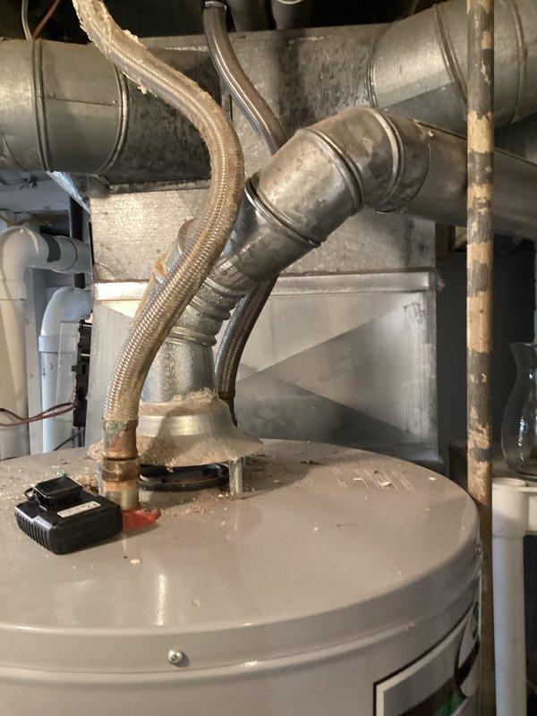 Completed comprehensive furnace super tune-up on 13-year-old Carrier unit. Performed full system inspection, cleaned and tested all components, verified proper operation of heating system, and documented equipment condition with photos showing HVAC ductwork, water heater connections, and mechanical room infrastructure.