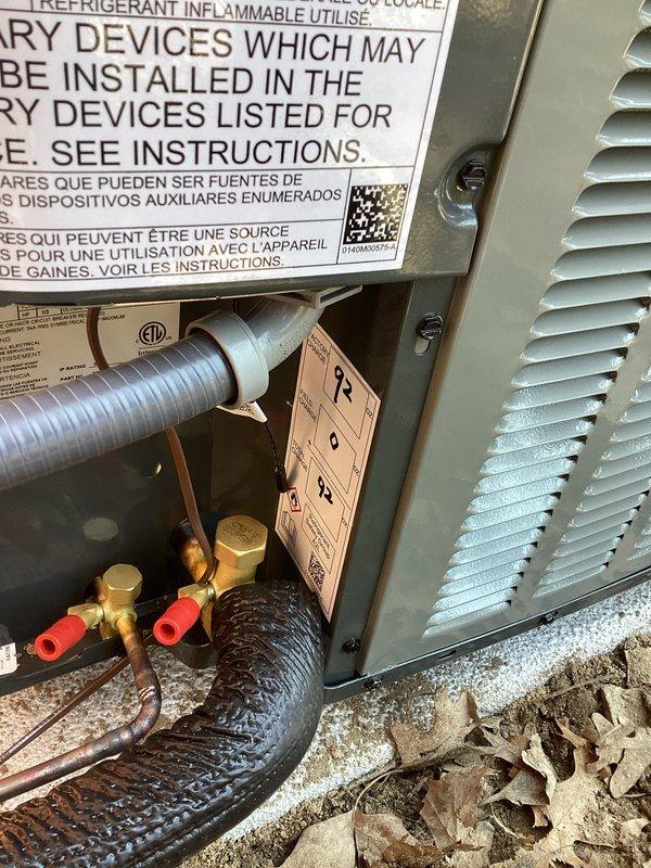 Completed full air conditioning system installation in basement utility area. Installed new outdoor condensing unit on concrete pad with proper refrigerant line connections, service ports, and electrical hookup. Connected system to existing ductwork infrastructure with appropriate flex duct transitions and verified all mechanical connections, refrigerant lines, and drainage systems are properly secured and operational.