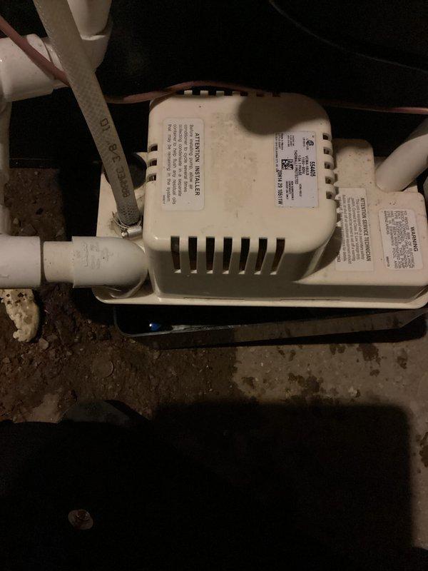 Completed annual AC tune-up and cooling system inspection on Energi Air unit. Observed significant condensation accumulation on air handler enclosure walls and multiple condensate drain lines with standing water in drain pan containing sediment buildup. Inspected condensate pump system, which showed dirt accumulation on housing and surrounding area but remained operational. All drainage components and PVC piping were verified for proper function to prevent water damage and ensure efficient moisture removal during cooling season.