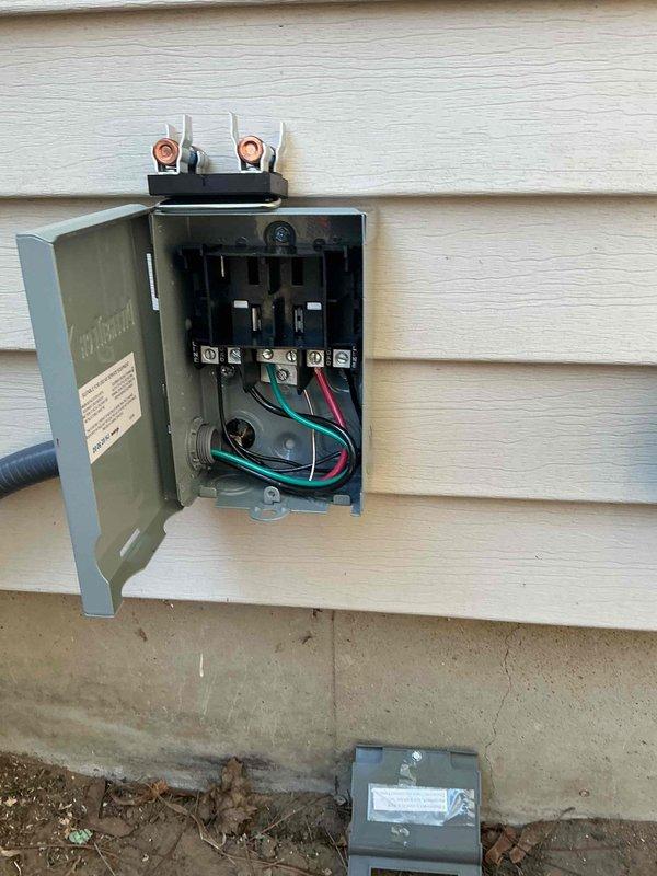 Completed full furnace replacement and new air conditioning system installation. Installed outdoor AC disconnect box on exterior wall with proper electrical connections, including double-pole disconnect switch, copper terminals, and appropriately sized wiring with ground. All electrical components secured per code requirements with conduit properly terminated and weatherproof enclosure mounted to building siding.