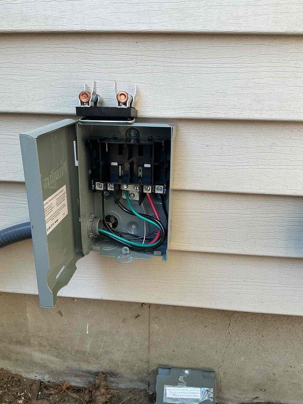 Completed full furnace replacement and new air conditioning system installation. Installed outdoor AC disconnect box on exterior wall with proper electrical connections, including double-pole disconnect switch, copper terminals, and appropriately sized wiring with ground. All electrical components secured per code requirements with conduit properly terminated and weatherproof enclosure mounted to building siding.