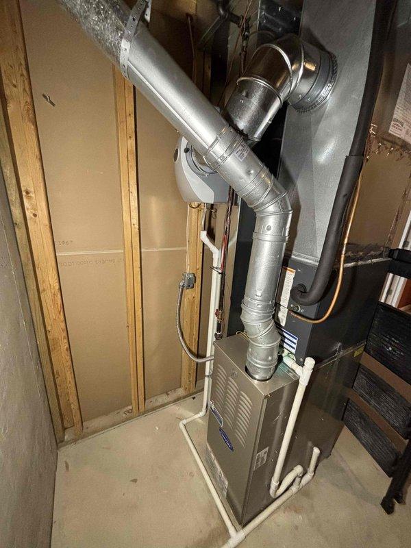 Completed installation of AprilAire whole-home humidifier integrated into existing HVAC ductwork system. Mounted humidifier control unit on main supply plenum with proper wiring connections, installed water supply line with saddle valve, and configured humidity settings for optimal performance. System tested and operational, providing automated humidity control throughout the residence.