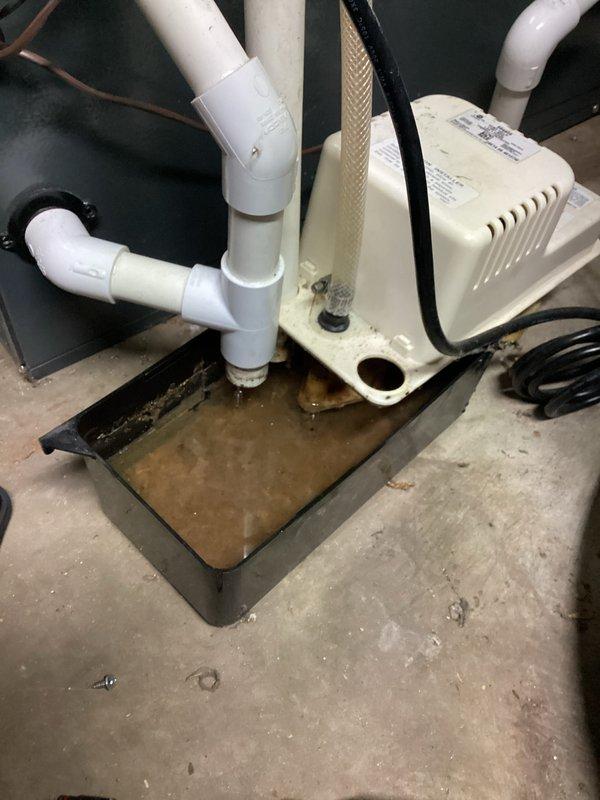 Completed annual cooling maintenance on EnergiAir system with warranty coverage through March 2030. Inspected condensate pump assembly and drainage system, noting proper operation with water collection in drain pan as designed. Verified PVC piping connections, P-trap configuration, and pump discharge lines are secure and functioning correctly. System operating within normal parameters with no immediate repairs required at this time.