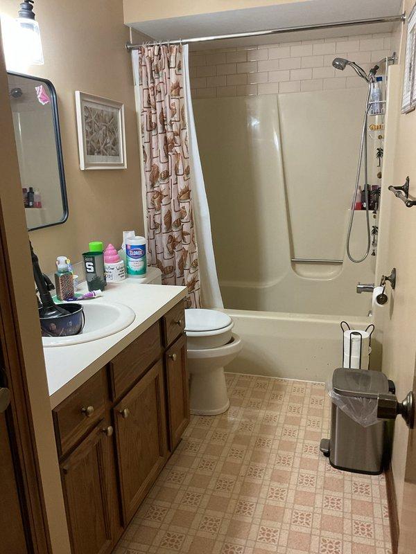 Completed drain cleaning service at residential bathroom as quoted. Accessed property through front door per arrangement with homeowners away. Successfully cleared and cleaned bathroom drains including tub/shower drain and vanity sink drain to restore proper water flow and drainage function.