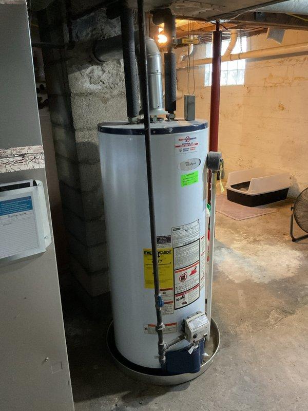 Conducted on-site assessment of leaking residential water heater in basement utility area. Evaluated existing unit, documented current installation conditions including water alarm system, ductwork proximity, and access clearances, and provided estimate for replacement with 40-gallon water heater to resolve active leak condition.