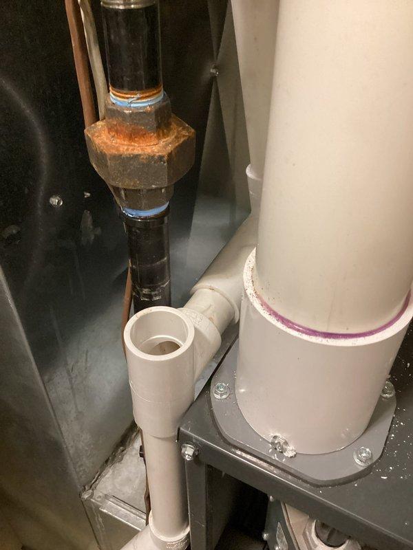 Completed annual air conditioning tune-up and maintenance on 17-year-old Carrier system. Performed comprehensive inspection of refrigerant lines, noting active condensation on suction line indicating proper system operation. Documented condition of plumbing infrastructure in mechanical area, including corroded brass fittings on water lines requiring future attention. Enrolled customer in recurring maintenance program covering furnace, air conditioner, and humidifier equipment.