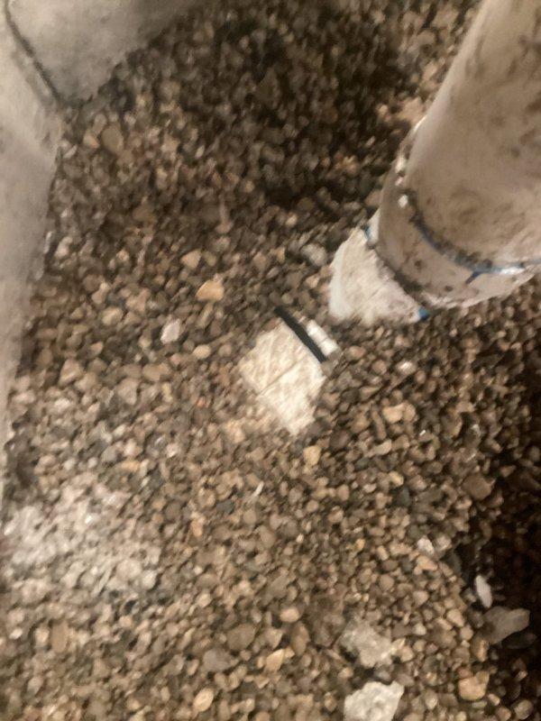 # Underground Plumbing Rough-In Rework

Completed underground plumbing rough-in modifications requiring concrete demolition and excavation in crawl space area. Reworked existing drain and vent piping systems, installing new PVC drainage lines per code requirements. Project completed over 1.5 days with all underground plumbing infrastructure properly installed and inspected.

## Work Performed

Demolished concrete flooring to access existing underground plumbing infrastructure. Excavated and exposed compromised drain lines requiring replacement. Removed deteriorated piping sections and reworked rough-in configuration to meet current plumbing code standards.

Installed new PVC drainage piping with proper slope and grade for optimal flow. Configured vent stack connections to ensure adequate drainage system ventilation. Secured all pipe connections with appropriate fittings and couplings, pressure-testing joints for leak integrity.

Backfilled excavated areas with approved granular materia